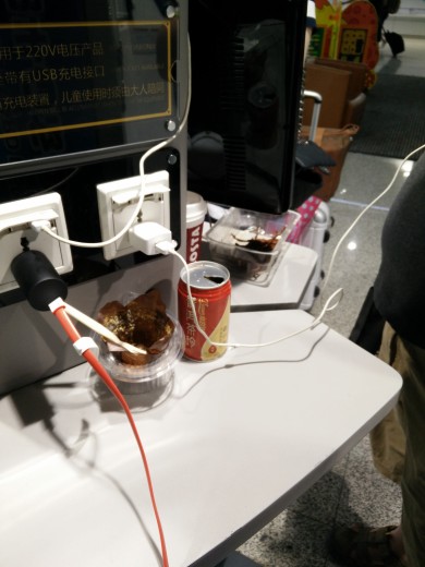 Patrons' food and garbage at a charging station in PEK T2